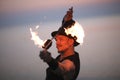 Portrait of fire dancer spinning poins over his he Royalty Free Stock Photo