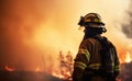 Portrait of a firefighter looking at dramatic forest fire caused by hot weather Royalty Free Stock Photo