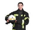 Portrait of firefighter in uniform with helmet on white