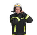 Portrait of firefighter in uniform wearing helmet on white