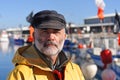 A portrait of a fisherman in the harbor