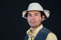 A portrait of a fisherman isolated against black background