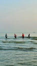 Portrait of a fisherman netting fish in the sea in the morning Royalty Free Stock Photo