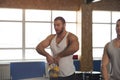 Fit And Concentrated Young Man Training With Kettlebell in Gym. Royalty Free Stock Photo