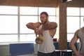 Fit And Concentrated Young Man Training With Kettlebell in Gym. Royalty Free Stock Photo