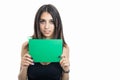 Portrait of fit girl holding green cardboard