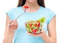 Portrait of a fit healthy woman eating a fresh salad isolated Royalty Free Stock Photo