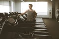 Portrait of a fit man in sportswear standing beside a treadmills in a gym. Active Lifestyle. Getting Better. Gym Royalty Free Stock Photo