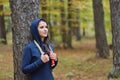 Portrait of fit young woman with jump rope in a park against autumn colors Royalty Free Stock Photo