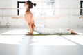 Portrait of fit young woman practicing yoga indoor white class. Handsome girl practice cobra asana in sunny gym Royalty Free Stock Photo