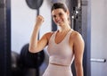 Portrait, fitness and bicep with a woman athlete flexing her arm muscle in the gym during a workout. Exercise, strong Royalty Free Stock Photo