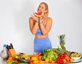 Portrait of  fitness blonde long-haired happy woman with heap Of vegetables. Isolated. Royalty Free Stock Photo