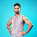 Portrait, fitness and confident Asian man sweat in studio isolated on a blue background. Face, serious and personal