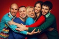 Portrait of five stylish close friends hugging Royalty Free Stock Photo