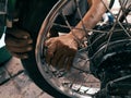 Portrait fixing old motorcycle tires