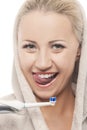 Portrait of Flirting Caucasian Blond Woman in Bathrobe Cleaning Royalty Free Stock Photo