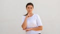 Portrait of flirty young woman making silence gesture Royalty Free Stock Photo