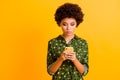 Portrait of focused afro american smm worker girl use smartphone read social media news wear stylish bright outfit