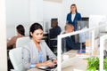 Focused asian woman entrepreneur working with laptop in office Royalty Free Stock Photo