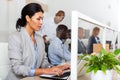 Focused asian woman entrepreneur working with laptop in office Royalty Free Stock Photo