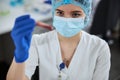 Medical laboratory scientist holding a test tube before the eyes