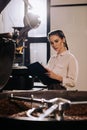 portrait of focused coffee roaster with notepad checking Royalty Free Stock Photo