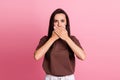 Portrait of focused concentrated girl arms palms cover mouth mute silent isolated on pink color background