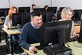 Focused mature man during computer classes Royalty Free Stock Photo