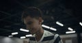 Portrait focused schoolboy playing table football in school campus alone. Royalty Free Stock Photo