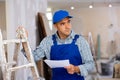 Portrait of foreman with documentation in apartment, renovation works