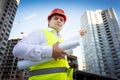 portrait of foreman in helmet showing building site under construction Royalty Free Stock Photo