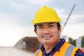 Portrait of Foreman worker in hardhat at the infrastructure construction site, Construction engineer checking project at the Royalty Free Stock Photo