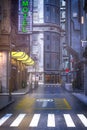 Portrait format 3D rendering of a dark moody old city street in a seedy downtown area