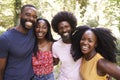 Portrait of four black adult friends on a walk in the forest Royalty Free Stock Photo