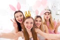 Portrait of four charming lovely girls take selfie demonstrate v-sign eye wink pouted lips bedroom indoors Royalty Free Stock Photo