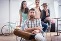 Four co-workers wearing casual clothes during work in a modern hub