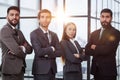 Portrait of four office workersr arms over their chest. Royalty Free Stock Photo