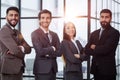 Portrait of four office workersr arms over their chest. Royalty Free Stock Photo