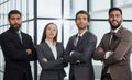 Portrait of four office workersr arms over their chest. Royalty Free Stock Photo