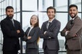 Portrait of four office workersr arms over their chest. Royalty Free Stock Photo