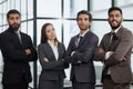 Portrait of four office workersr arms over their chest. Royalty Free Stock Photo