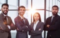 Portrait of four office workersr arms over their chest. Royalty Free Stock Photo