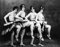 Portrait of four young women performing a dance Royalty Free Stock Photo