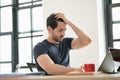 Portrait of freelancer or office man having headaches, stressful of work, depressed or having a fever while working at the office