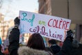 Portrait of french teacher protesting with placard in french : prof en colere et celibataire, in english : angry teacher and sing