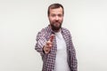 Portrait of friendly bearded young man giving hand to handshake, getting acquainted at job interview. white background Royalty Free Stock Photo