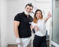 Portrait of friendly male dentist with happy female patient after treatment in modern dental office. Dentistry Royalty Free Stock Photo