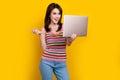 Portrait of friendly nice woman with nose piercing dressed knitwear top comunicating on laptop webcam isolated on yellow