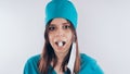 Portrait of a friendly smiling doctor woman or nurse in white medical uniform, on white background with copy space. Heal