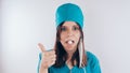 Portrait of a friendly smiling doctor woman or nurse in white medical uniform, on white background with copy space. Heal